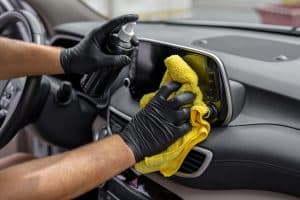 hand-cleaning-the-car-interior-with-microfiber-cloth-towel