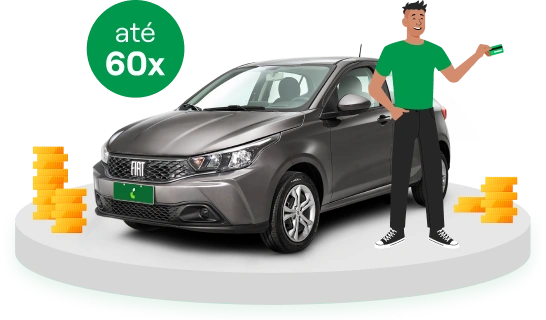 Um carro hatch e ao lado um homem  parado de pé segurando um cartão de crédito.